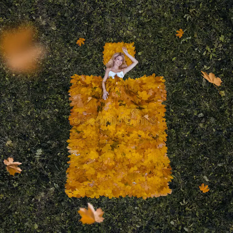 a lady lying down on grass