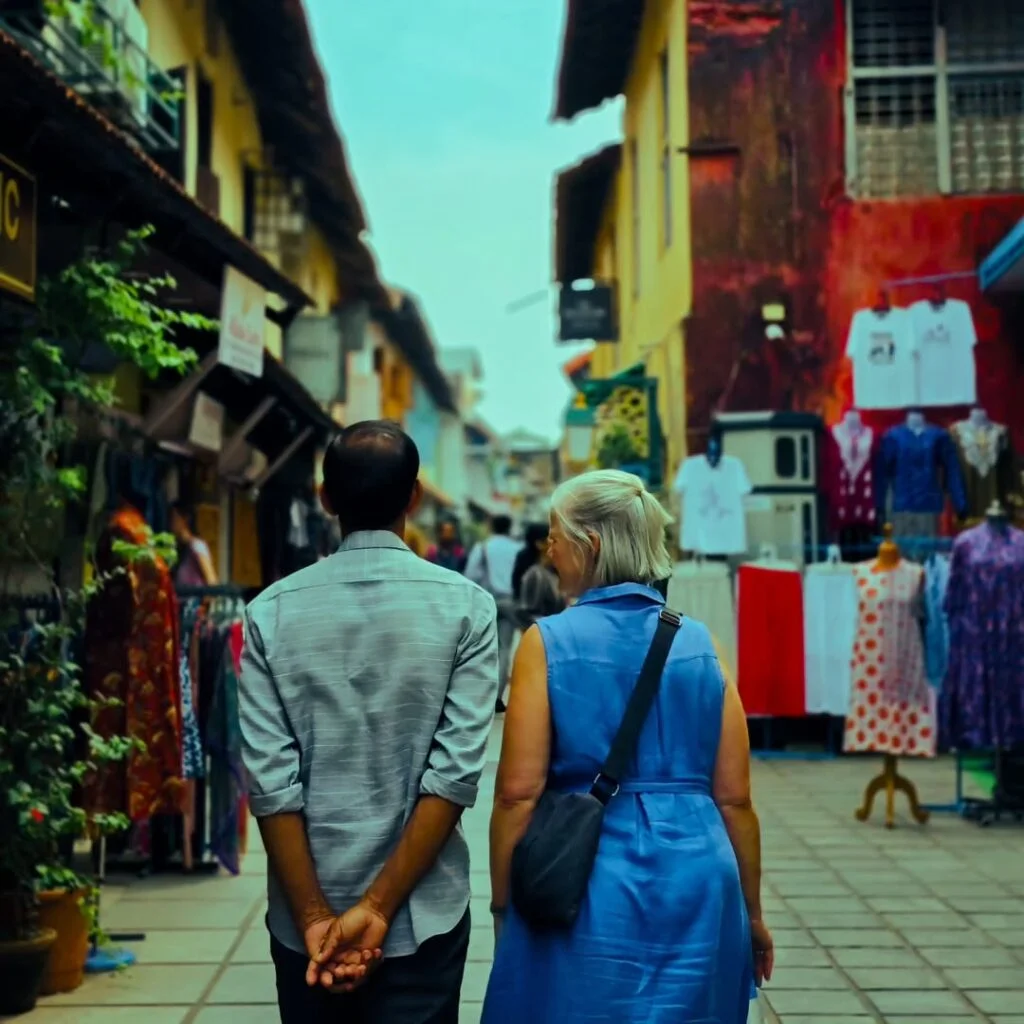 two foreigners walking through jew street